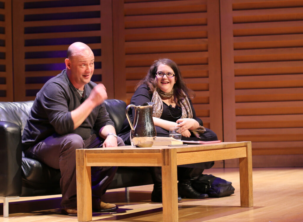 A man and a woman on stage