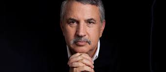 A close up image of a white man in a suit with a black background
